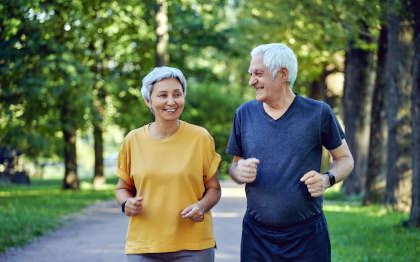 Elderly couple taking a light jog