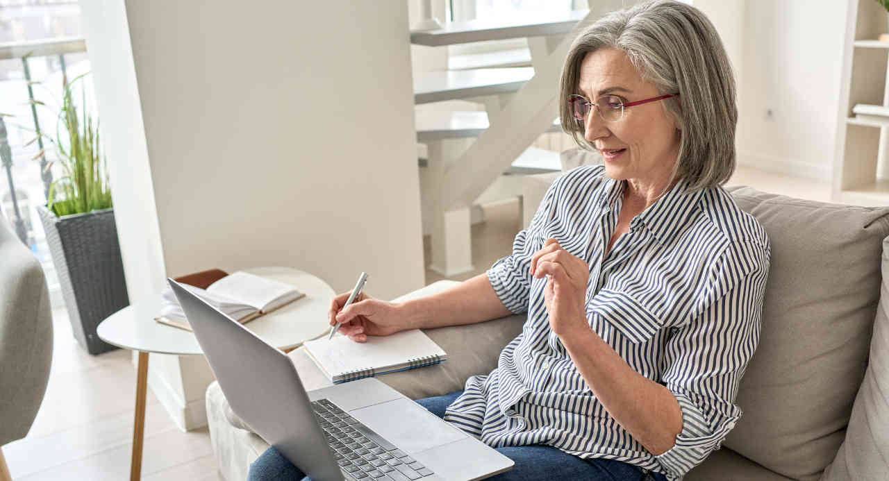 Senior woman researching work-from-home jobs for retirees