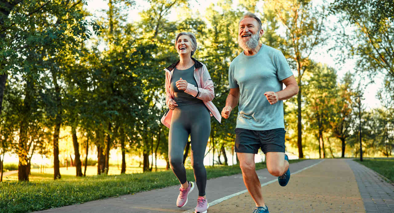 Senior couple jogging to improve bone health