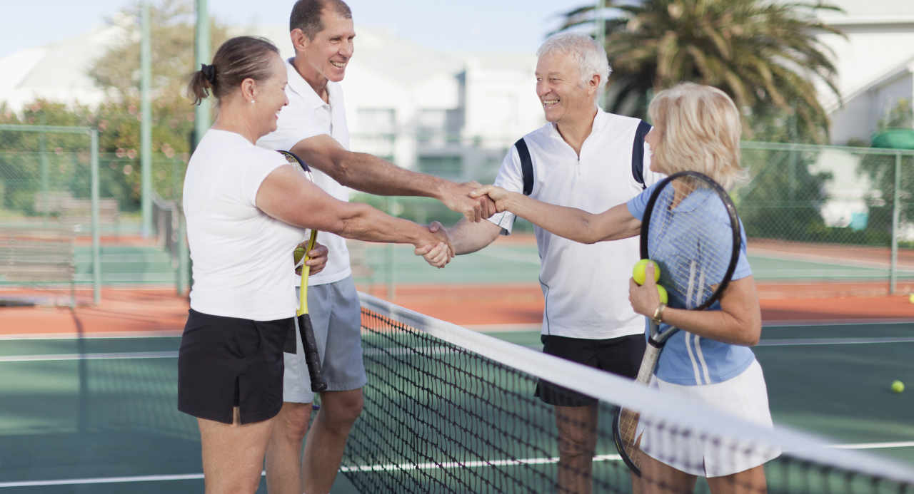Seniors playing tennis for entertainment