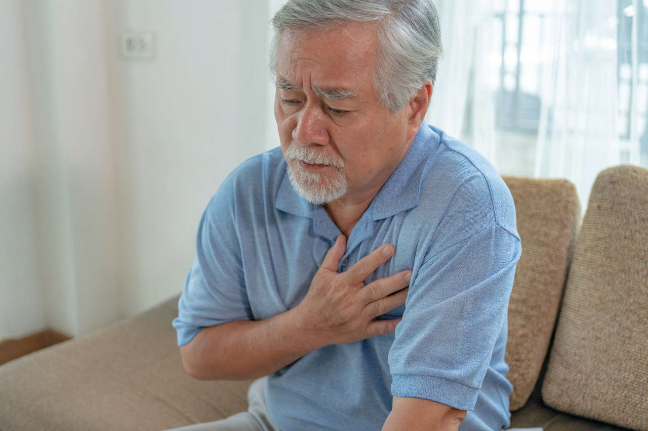 Mature Asian man with chest pain from coronary artery disease