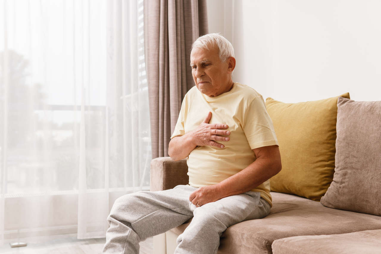 Senior man experiencing acid reflux from gastroesophageal reflux disease