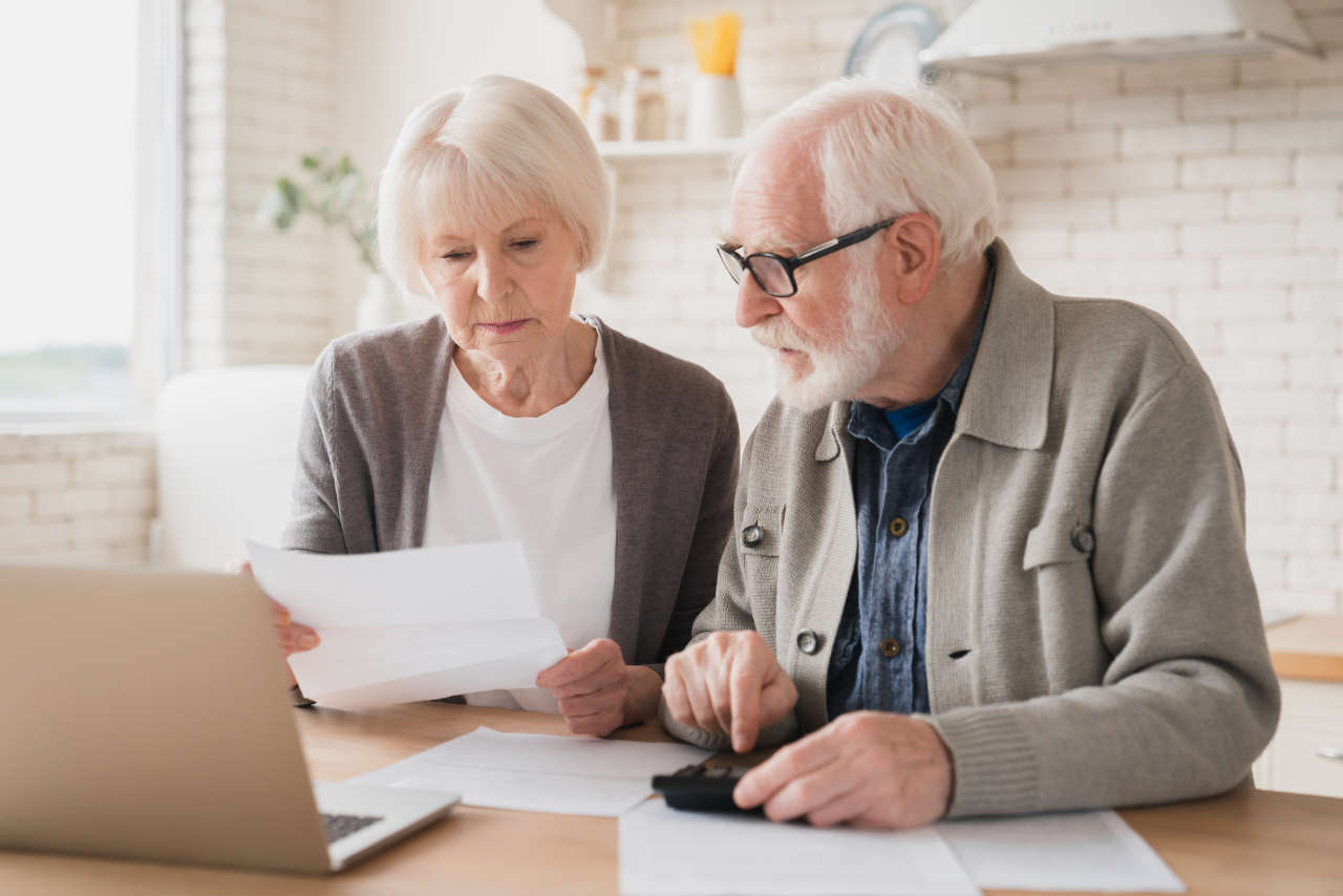 Senior couple contemplating on how to reduce utility bills